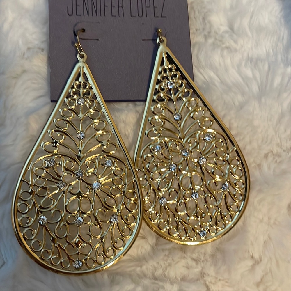 Jennifer Lopez gold teardrop earrings.